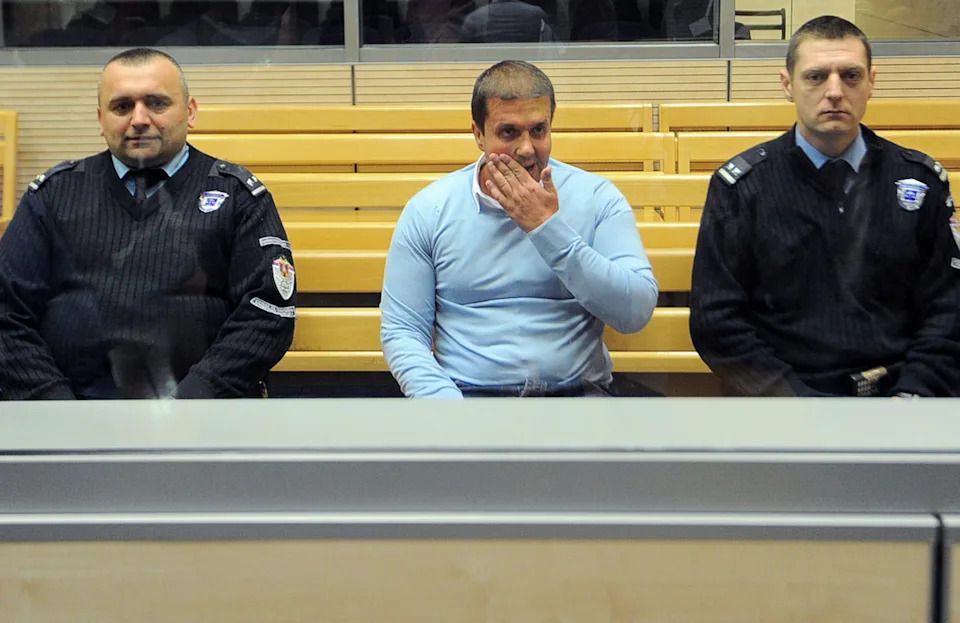 Darko Šarić (centre), on trial in Belgrade in 2014. Šarić is alleged to be the mastermind behind a cocaine trafficking network with links across Europe and South America.