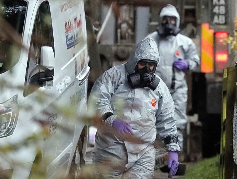 Personnel in protective gear work on a van in Winterslow, 12 March, 2018