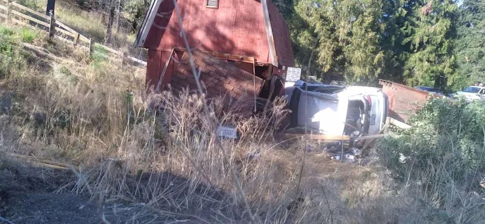 Out of control vehicles flying off the Highway 97 embankment often crash into Burton's barn, shed, or boat, causing thousands of dollars in damage and insurance claims.