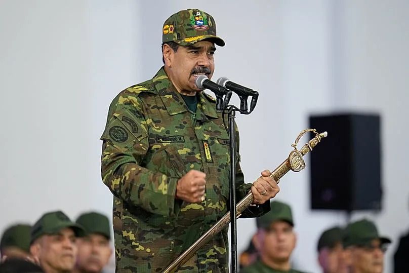 Venezuelan President Nicolas Maduro holds a ceremonial sword said to have belonged to independence hero Simon Bolivar in Caracas, 25 November 2025