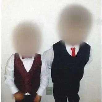 J.L. and L.L., left to right, are shown in an undated photo filed as a court exhibit. Their Burlington, Ont., teachers described them as clever, curious and eager students.