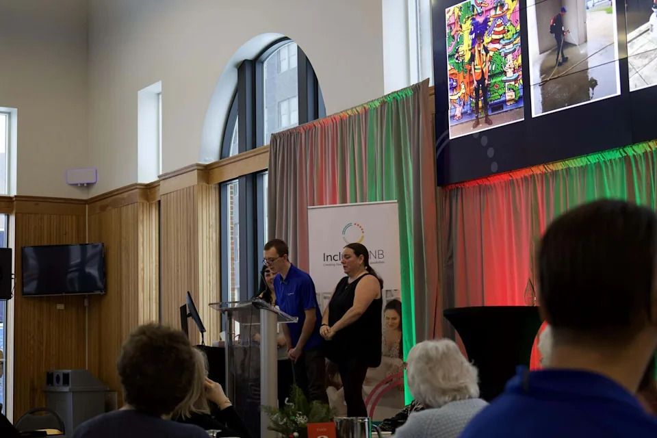 Jaxson spoke at Inclusion NB's event on Dec. 4 to share his story about transitioning to the workforce. He was joined at the podium by his proud mom, Melissa Carhart.