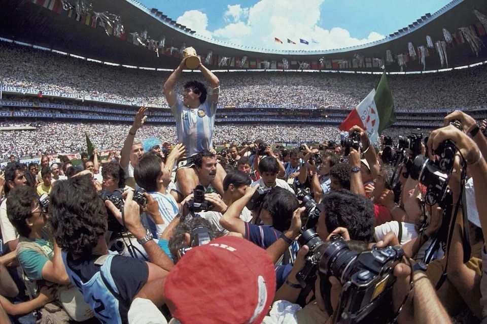 In this June 29, 1986 file photo, Diego Maradona holds up his team's trophy after Argentina's 3-2 victory over West Germany at the World Cup final soccer match at Azteca Stadium in Mexico City.