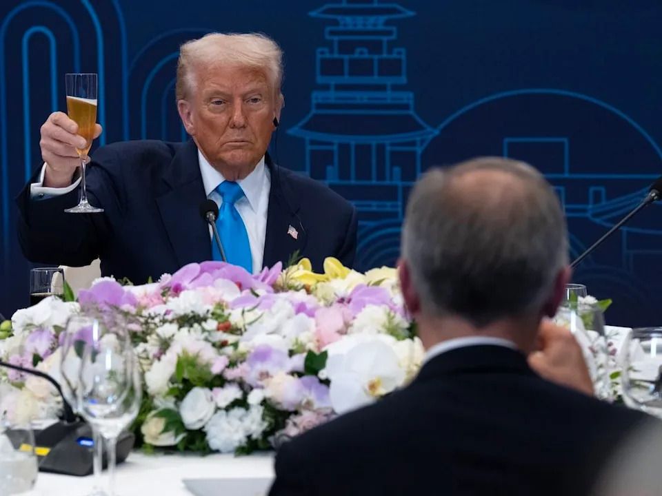 United States President Donald Trump looks towards Prime Minister Mark Carney as they raise their glasses during a toast at a working dinner in Gyeongju, South Korea, on Wednesday, Oct 29, 2025.