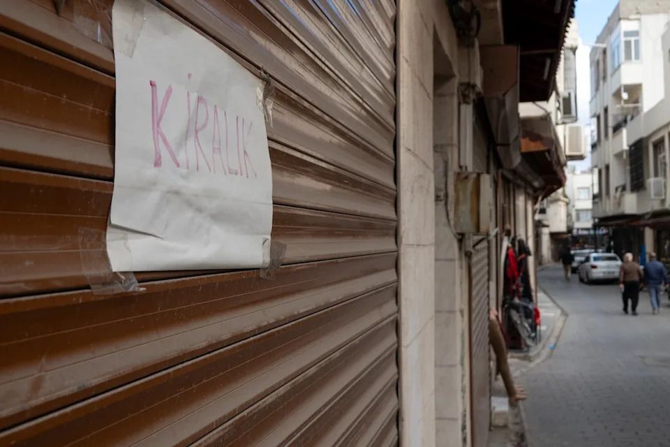 A sign advertising that a vacant store is for rent in Kilis, Turkey on Dec. 1 2025. The city, which lies just over 4 km from the border with Syria, has seen many of its Syrian residents leave and return home.
