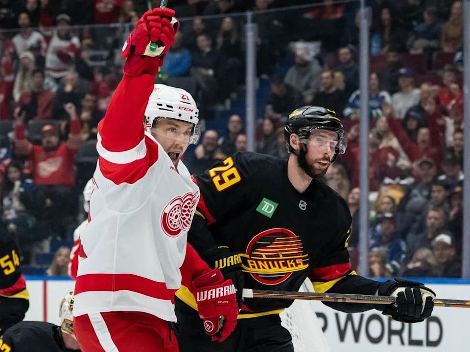 Detroit Red Wings’ James van Riemsdyk (21) celebrates his goal as Marcus Pettersson (29) skates away during the first period