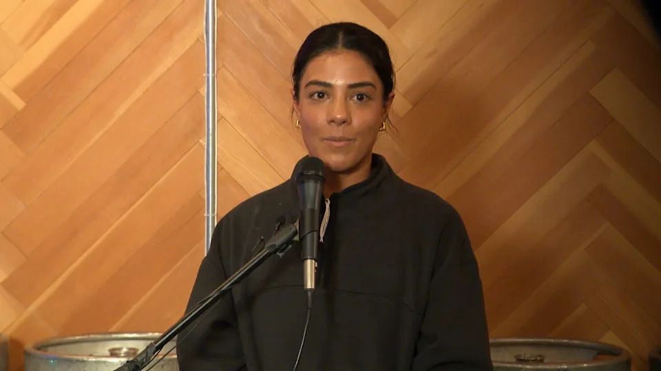 Tara Shayegan co-owner of Uphoria Yoga Inc. speaks at a community forum on Monday Dec. 9, 2025 in Vancouver's Mount Pleasant neighbourhood about how construction of the Broadway Subway project was affecting her business.