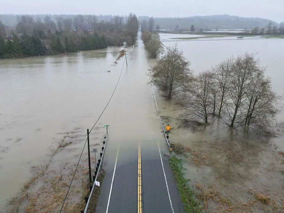 The flooding Snoqualmie River has closed NE 124th St., which connects W. Snoqualmie Valley Rd. NE on the Redmond side, and SR-203 on the Duvall and Carnation side, Wednesday, Dec. 10, 2025, near Novelty, Wash.
