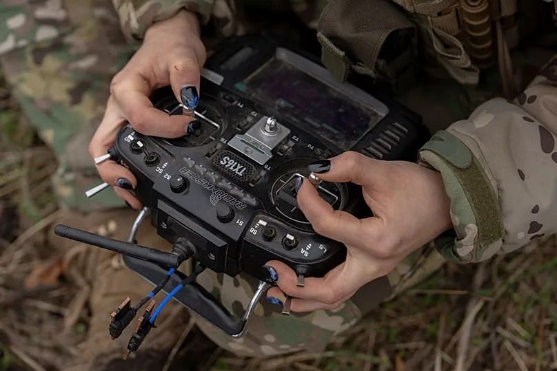 A Ukrainian FPV drone operator from the third assault brigade pilots an FPV drone in Kharkiv region, Ukraine.