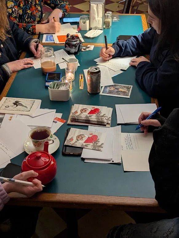 People gather at Williams's café to write letters together. (Submitted by Audra Williams)