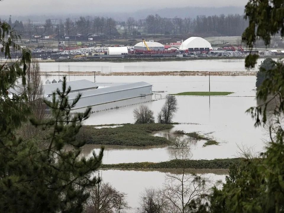 Flooding along the Trans Canada Highway at Whatcom Road area in Abbotsford,  Friday, December 12, 2025. Heavy rainfall earlier this week caused the Nooksack River to flood, draining into the Sumas Prairie around Abbotsford.