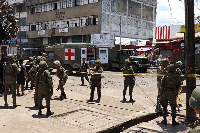 Police and military secure the site of an explosion in the town of Jolo suspected to have been carried out by Abu Sayyaf militants, 24 August, 2020