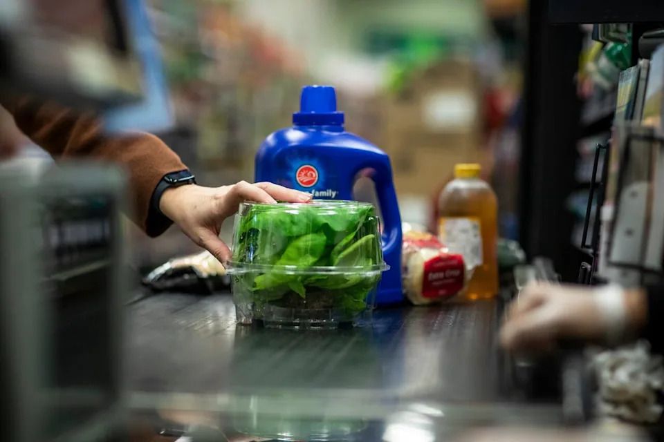 A cashier scans grocery products from Canada at a supermarket in Vancouver on Feb. 28, 2025.