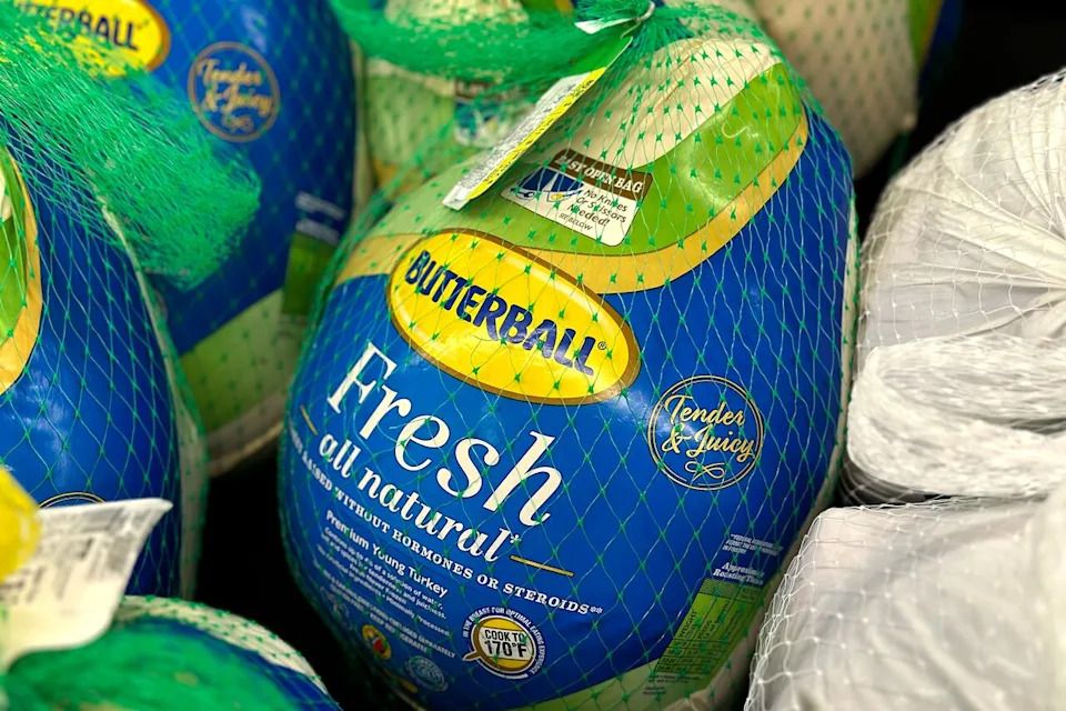 Frozen whole young turkeys sit in a refrigerated case inside a grocery store in Glenview, Ill., Monday, Nov. 25, 2024.