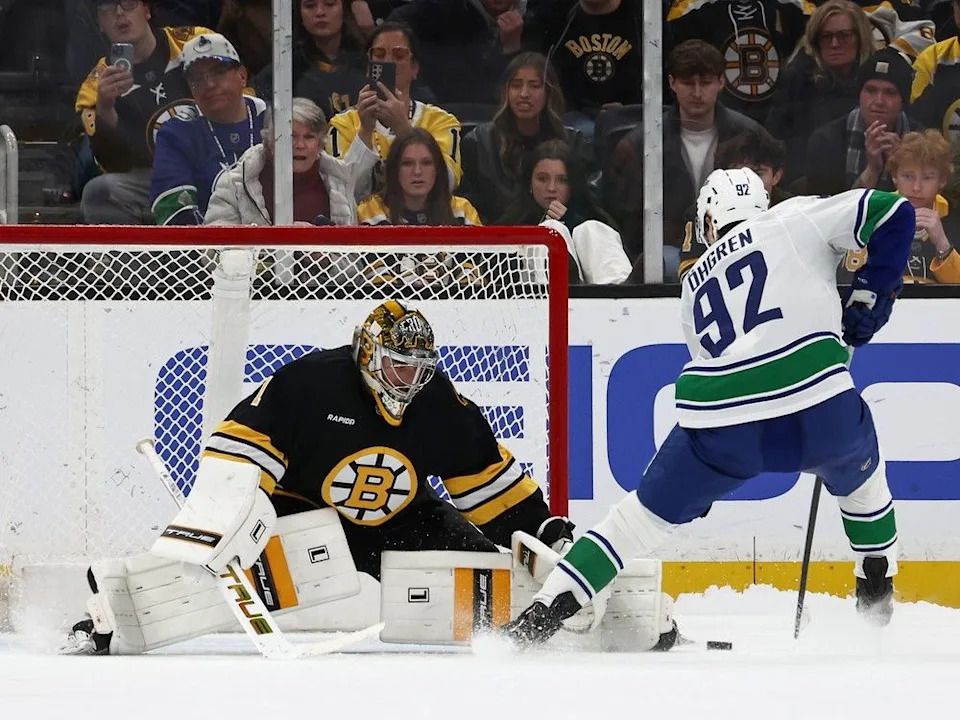 Liam Ohgren of the Vancouver Canucks scores the only goal in a seven round shootout on Jeremy Swayman of the Boston Bruins at TD Garden on Dec. 20, 2025 in Boston, Massachusetts.