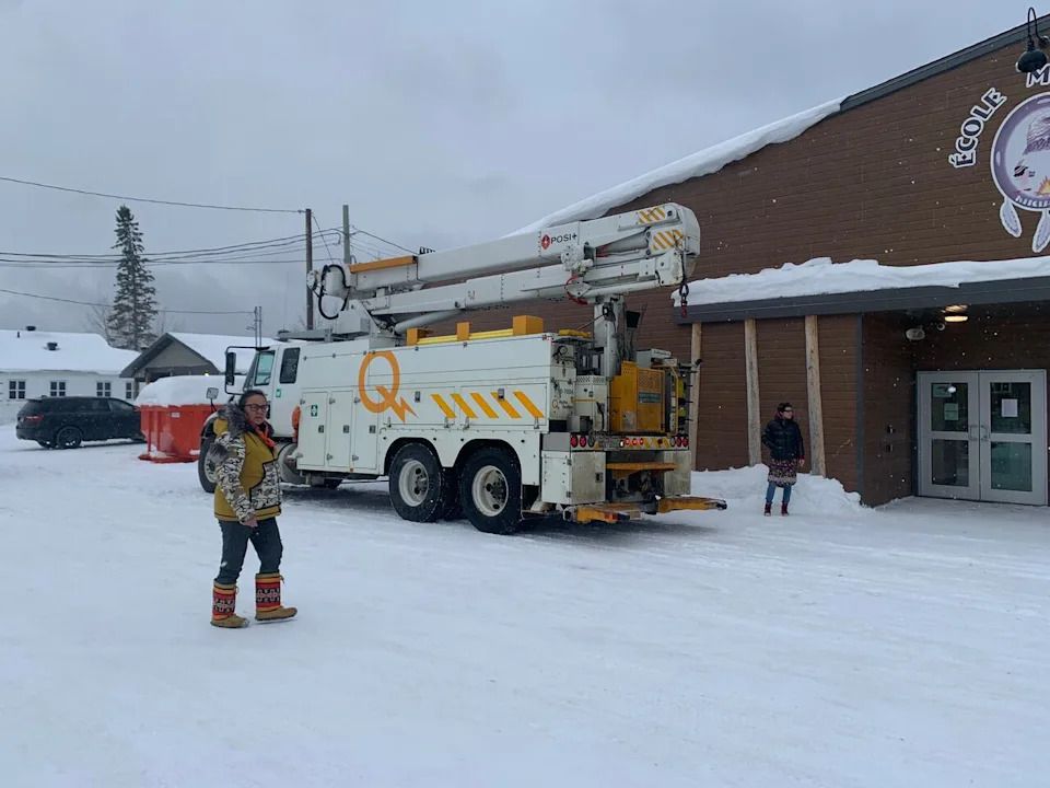 A Hydro-Québec vehicle stopped in front of the elementary school in Kitcisakik. Residents say finally getting electricity caused celebration in town.