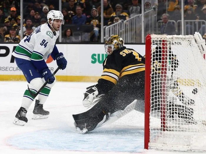 Linus Karlsson of the Vancouver Canucks scores on Jeremy Swayman of the Boston Bruins during the second period at TD Garden on Dec. 20, 2025 in Boston.