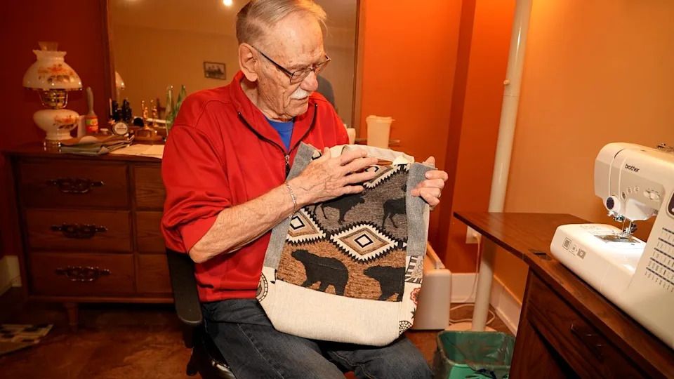 Peter Dyck shows one of his 850 shopping bag creations that help feed people in southeast Manitoba.