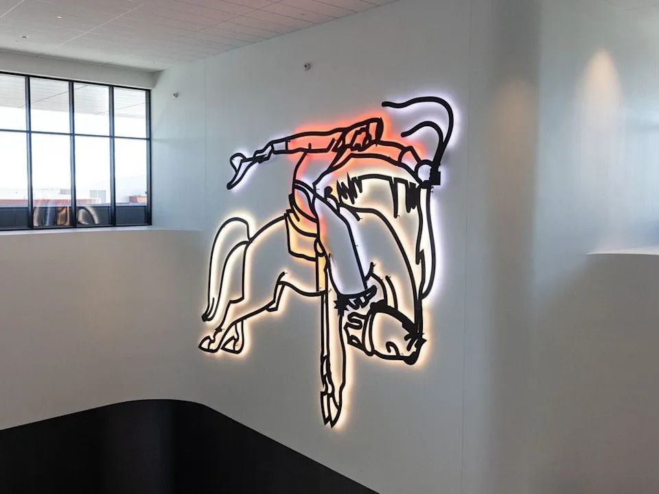 The ‘Neon Cowboy’ recreates the mural on the outside of the old Stampede Corral inside the expanded BMO Centre in Calgary on June 5, 2024.