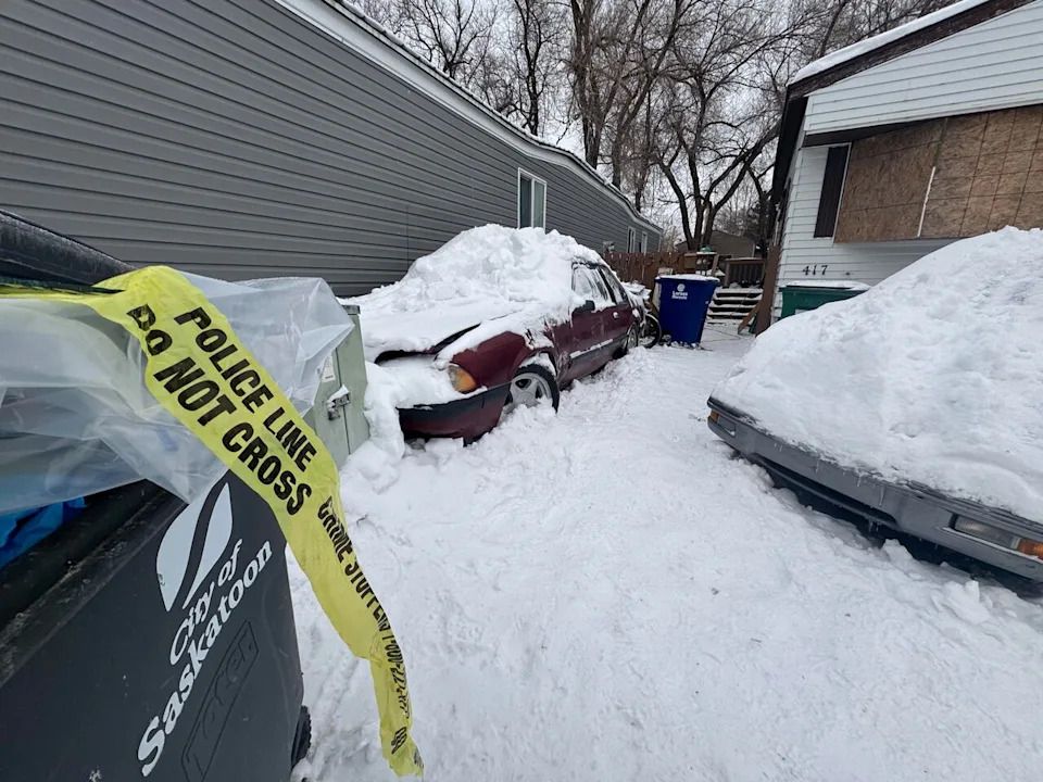 Police tape could be seen Monday outside a trailer in Rayner Place Park in Saskatoon where police shot a man on Friday night.