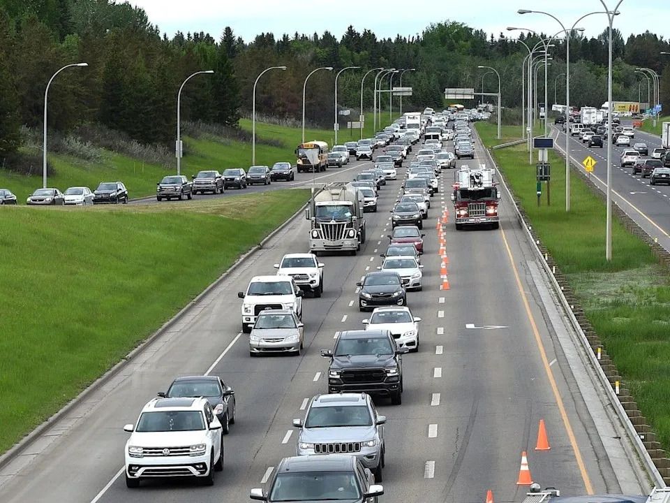 Fire trucks block off a lane of Whitemud Drive eastbound due to a crash near the 53 Avenue exit, south of the Quesnel Bridge, in June 2019 in Edmonton.