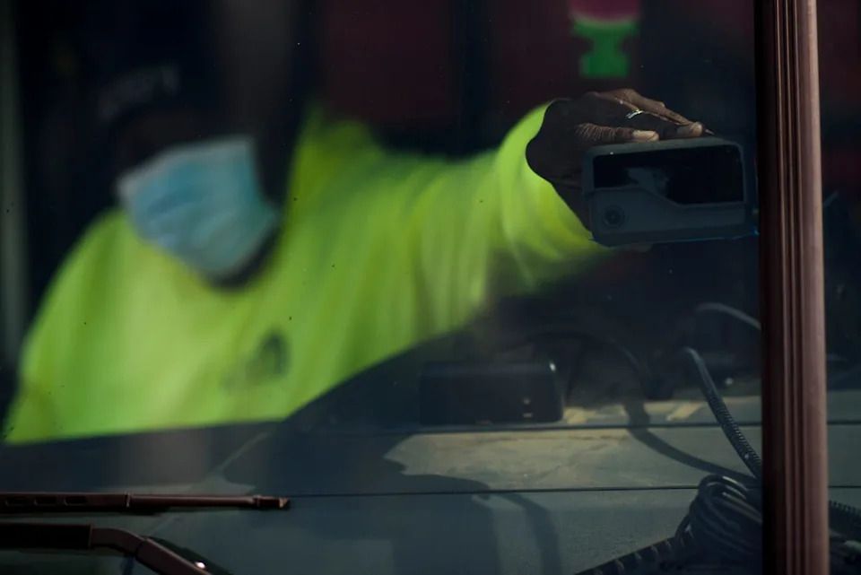 A driver adjusts a sensor at the front of a vehicle. Samsara collects safety data from all of its fleet vehicles, including information about crashes, harsh braking and speeding.