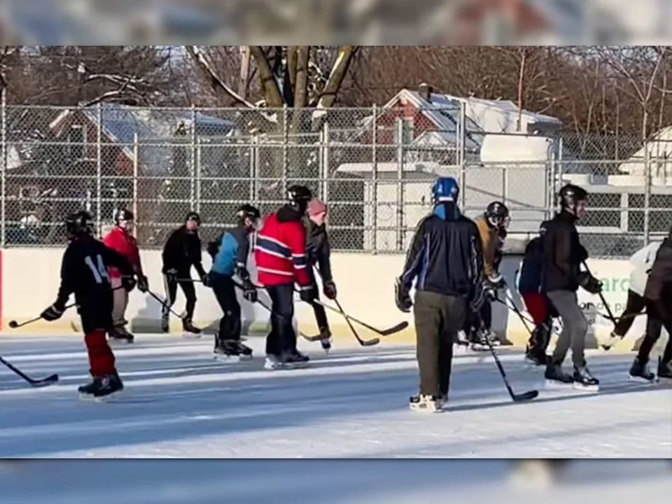 Canadiens defenceman Lane Hutson (centre in tuque) joined players at the Bleu Blanc Bouge rink in Notre-Dame-de-Grâce’s Confederation Park on Wednesday December 24, 2025.