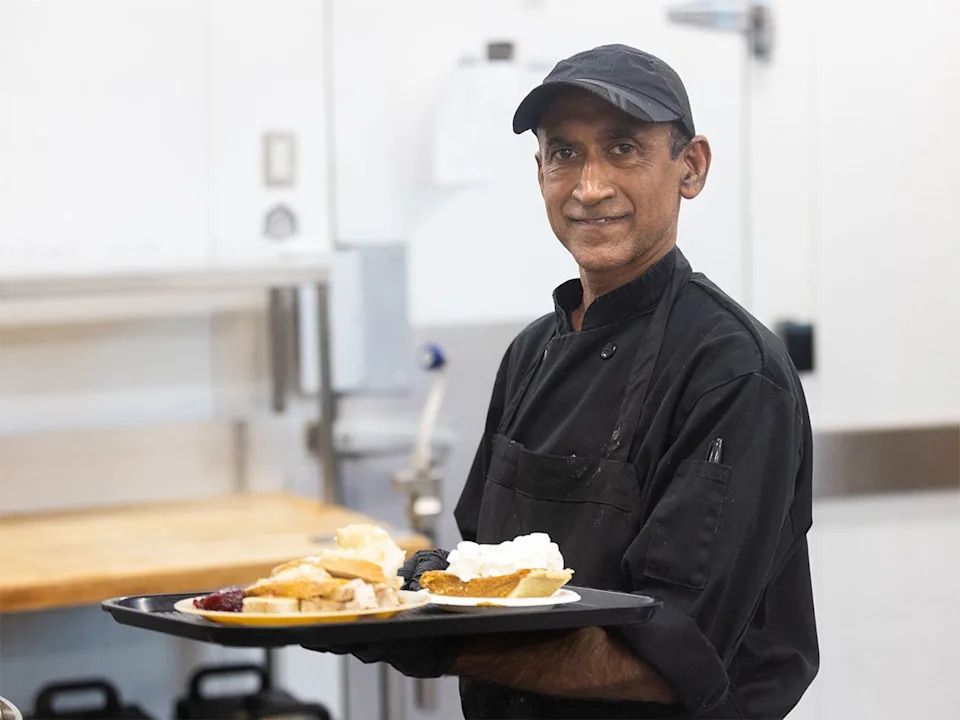 Chef Sam Perera holds a Christmas meal of turkey and pie at the Calgary Drop-In Centre on Christmas Day, Thursday, Dec. 25, 2025.