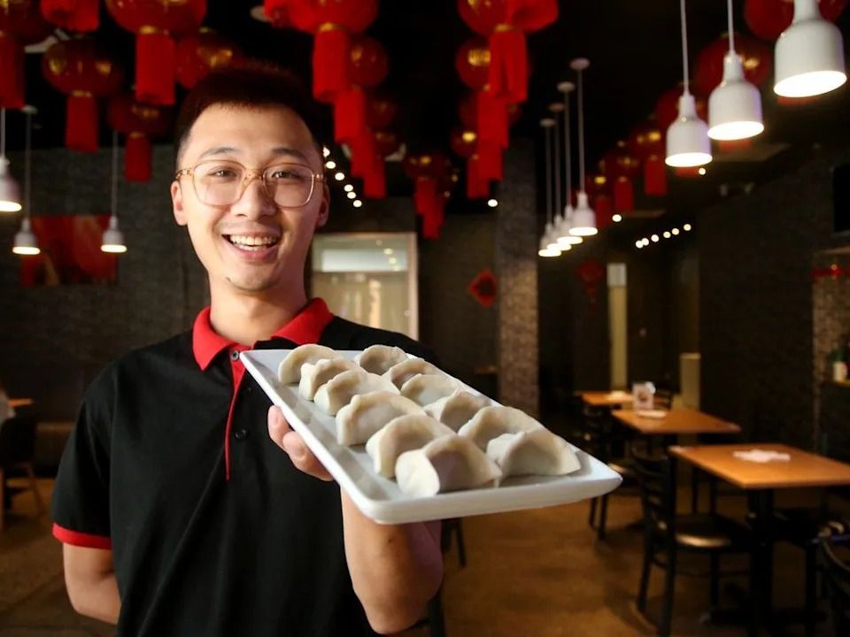 Doven Chan, co-owner of Dumpling Bliss, displays handmade, pre-cooked dumplings at the new Centretown restaurant.