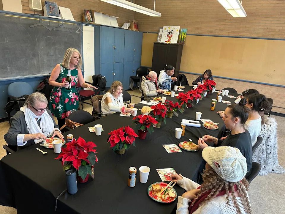Seniors, volunteers, Unison staff and CBC staff gathered for a holiday lunch to talk about Unison Market.