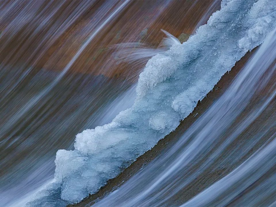 Water forms splash ice as it flows over the weir on the Bow River near Carseland, Ab., on Tuesday, Dec. 23, 2025.