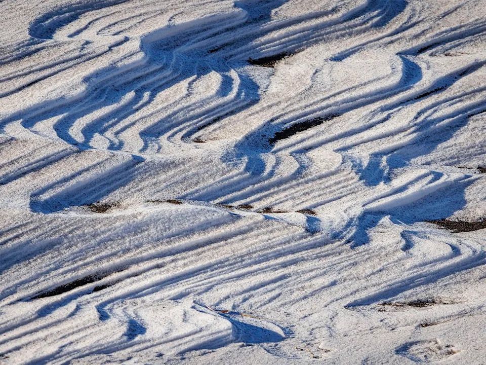 Sculpted snow drifts on the benchland above the Bow River near Carseland, Ab., on Tuesday, Dec. 23, 2025.