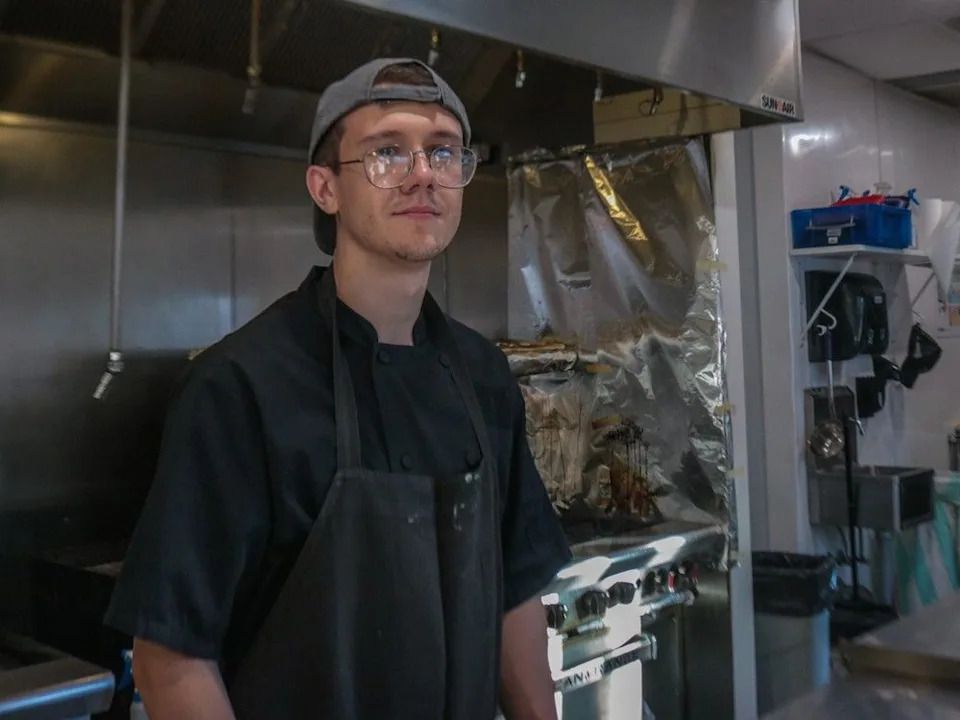 Oleksiy Sychuk &nbsp;is working as a line cook at two different restaurants, while hoping for good news that he can stay in Canada. For story by Payton Delisle-Miller