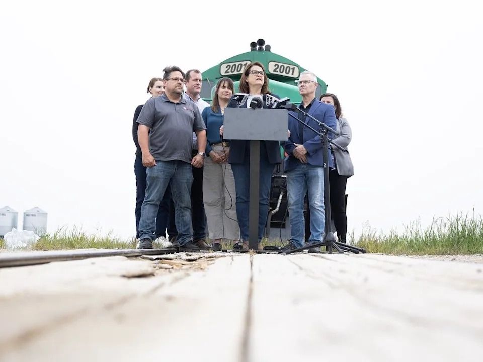 Saskatchewan NDP Leader Carla Beck speaks about short-line rails in front of a CRLX Locomotive on June 12, 2025 in Richardson.