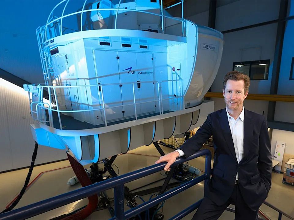 WestJet CEO Alexis von Hoensbroech stands next to one of the airline’s Boeing 737 flight simulators on Tuesday, Sept. 9, 2025.