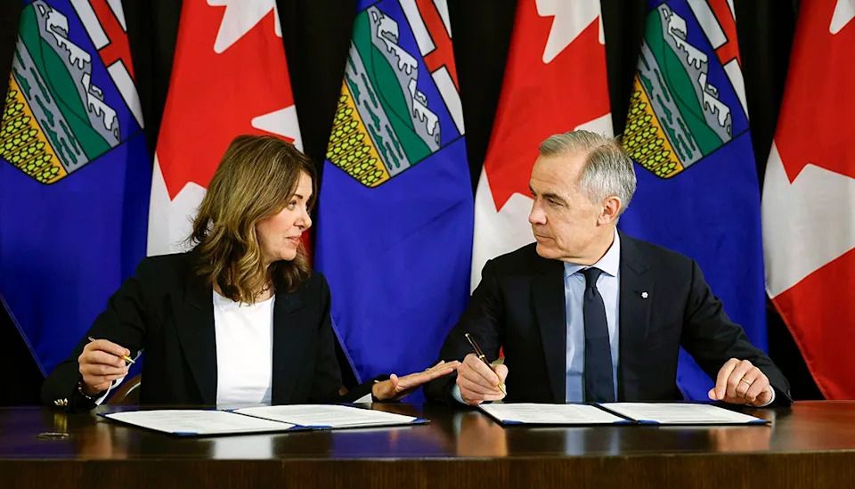 Alberta Premier Danielle Smith and Prime Minister Mark Carney sign an MOU in Calgary on Nov. 27, 2025.