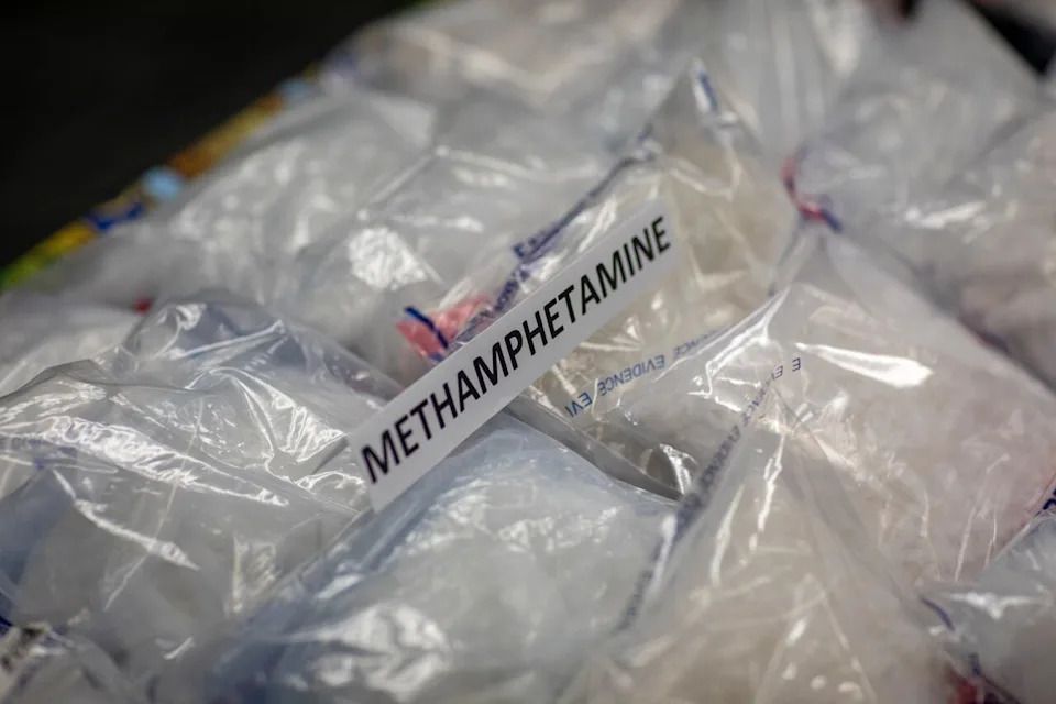 Methamphetamine along with firearms are pictured as the Surrey RCMP drug unit announce one of the largest drug seizures in Surrey, B.C, on Tuesday, November 19, 2024.