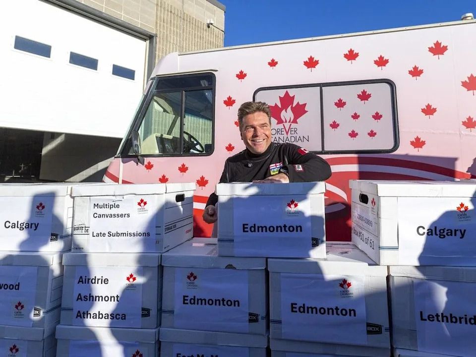 Thomas Lukaszuk delivers a petition with more than 400,000 signatures to the Elections Alberta building for the Forever Canadian petition on Oct. 28.
