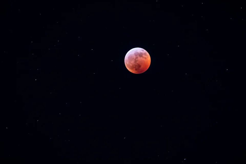 A total lunar eclipse is seen over Toronto in 2019.