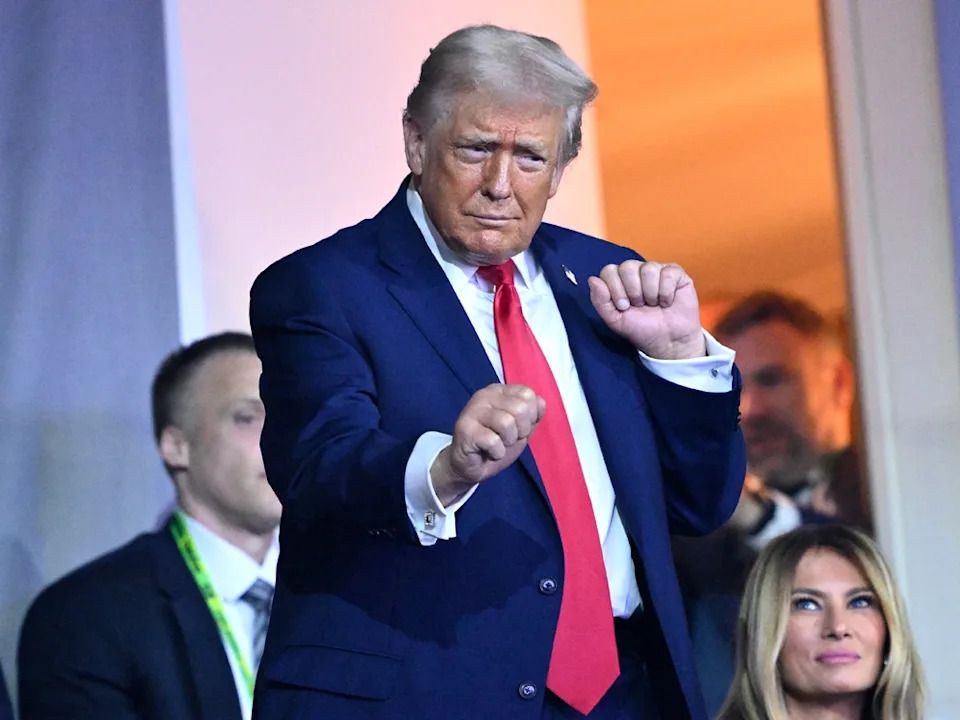 U.S. President Donald Trump dances to the final performance of the Village People during the FIFA World Cup 2026 Official Draw at John F. Kennedy Center for the Performing Arts on December 05, 2025 in Washington, DC. (Photo by /)