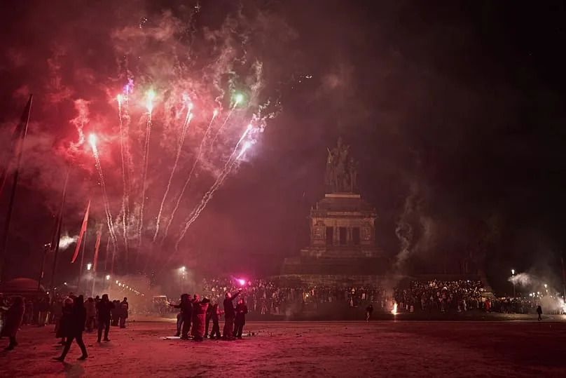 Visitors fire off New Year's Eve fireworks at the equestrian statue of Kaiser Wilhelm in Koblenz, 1 January, 2026
