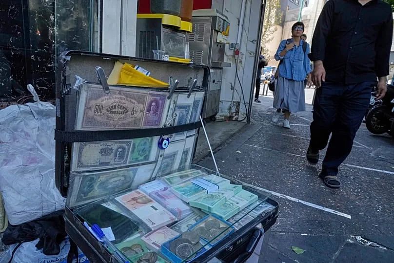 Iranian banknotes displayed by a street money exchanger in downtown Tehran, 28 August, 2025