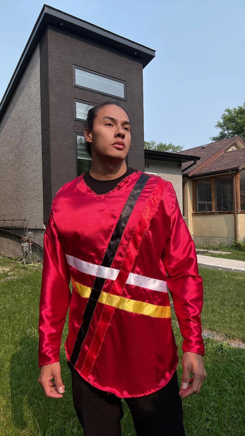 Tyler Moody, who is also a model, wears one of his ribbon shirt designs.