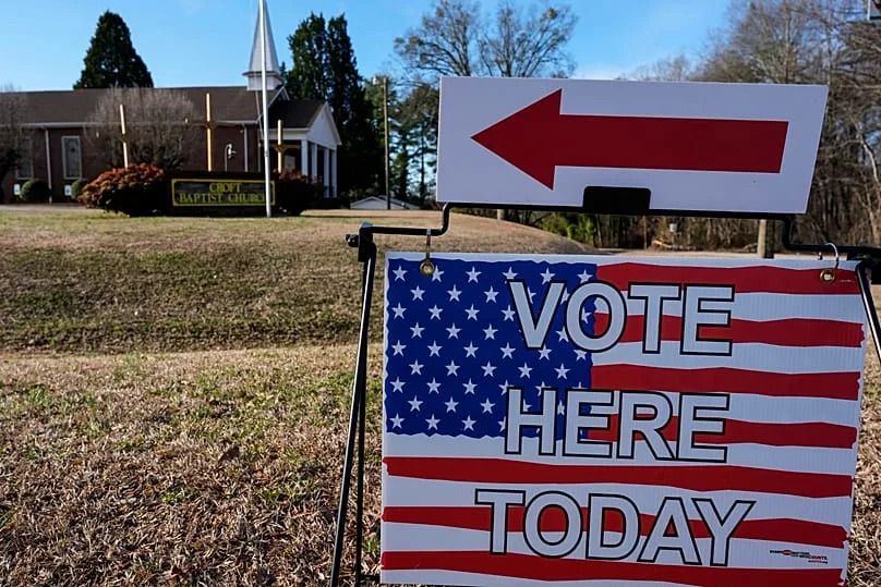 A voting sign is seen near a voting center at Croft Baptist Church in South Carolina.