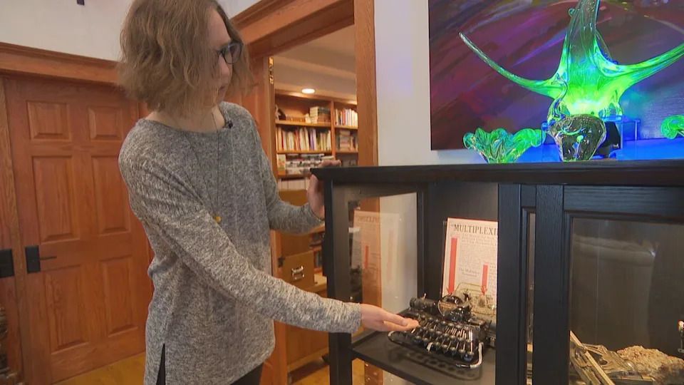 Spence shows off a Hammond Multiplex Open Universal typewriter which was introduced in 1913.