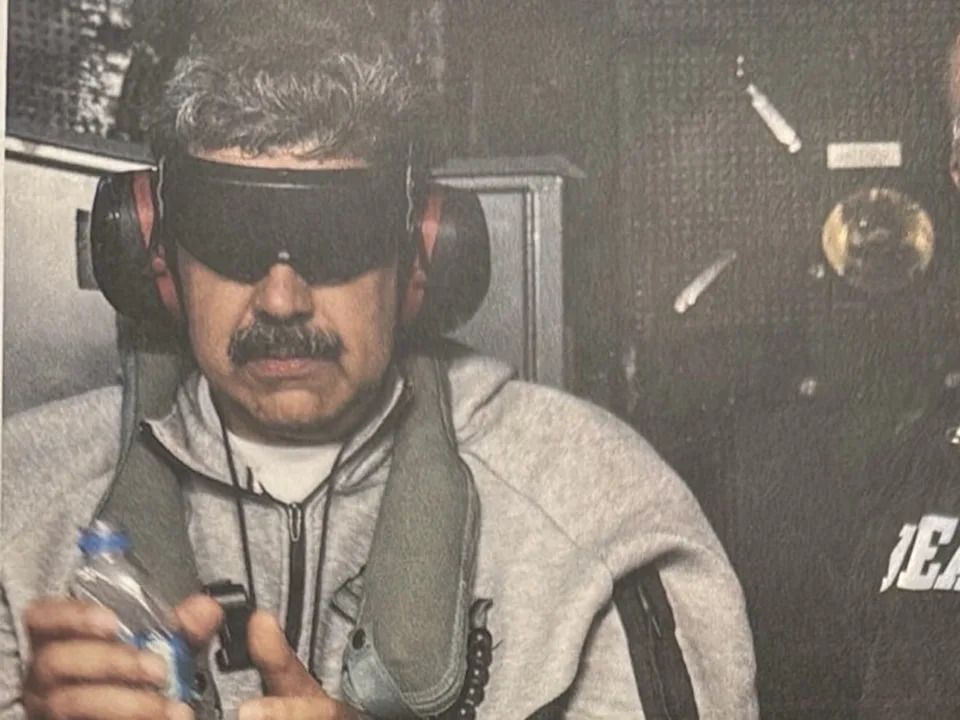 In an image shared on Truth Social by U.S. President Donald Trump, Venezuelan president Nicolas Maduro is seen captured aboard the USS Iwo Jima.