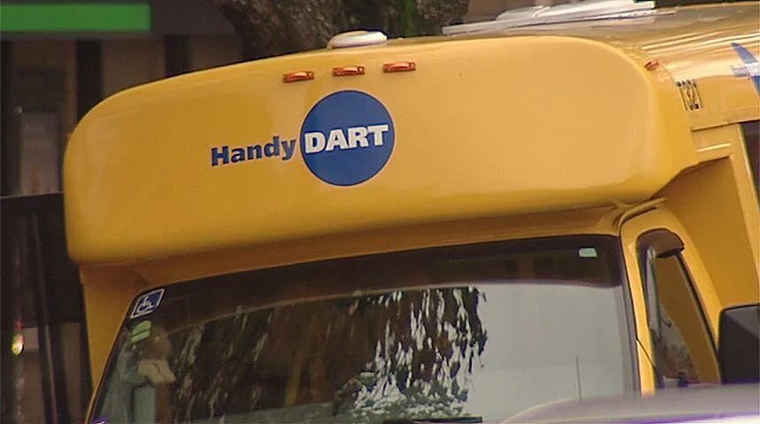 Stock image of a TransLink HandyDart / HandyDART logo on a bus in Metro Vancouver.