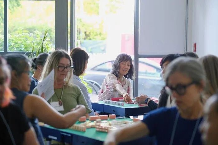 Lucky Tile Mahjong hosts classes and socials, as well as corporate events. This was taken at an introductory session in June 2025.