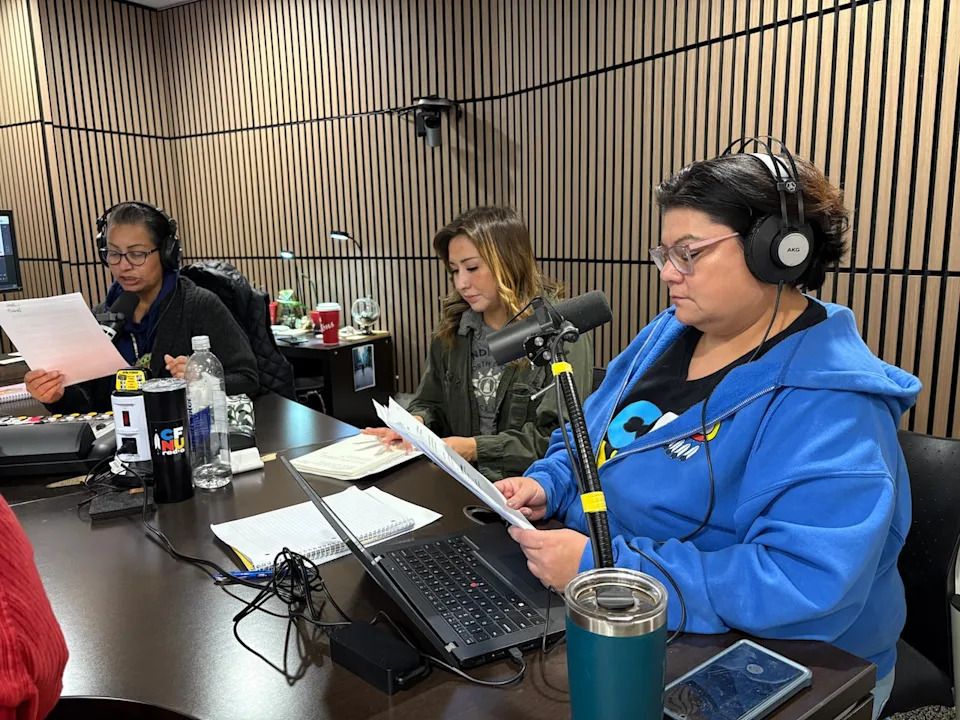 Lori Deets, right, presents the news on CFNU Radio’s Waná program. She’s hoping to use her radio skills in her career now that she has a degree in Indigenous journalism.