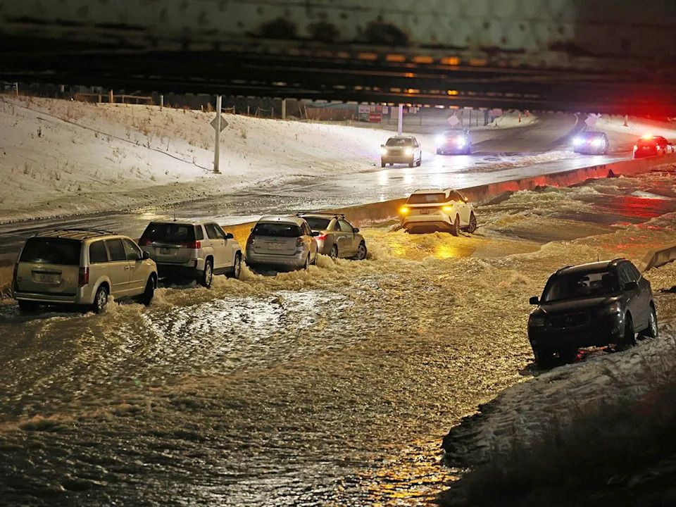 A major water main break flooded a large section of 16th Avenue N.W. in Montgomery and Bowness, stranding about 10 vehicles late on Tuesday, Dec. 30, 2025.